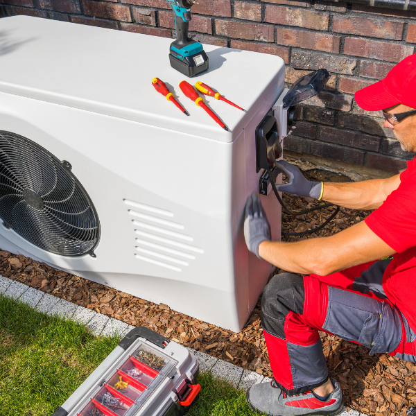 HVAC technician servicing a unit 